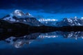 Snow-covered peaks of French Alps mirroring in Cheserys lakes Royalty Free Stock Photo