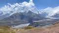 Snow-covered peaks, mountains and hills of Kyrgyzstan. The beautiful nature of the Pamirs. Panorama of amazing mountain landscape