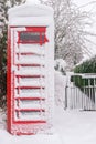 Snow covered British red phonebooth