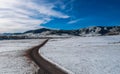 Snow plains in front of Rocky Mountains Royalty Free Stock Photo