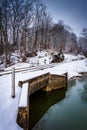 Snow covered railroad bridge over a creek in rural Carroll Count Royalty Free Stock Photo