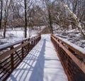 Snow covered red wood bridge Royalty Free Stock Photo