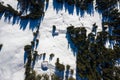 Snow covered remote cottage, homestead in the mountains and ski sloap Royalty Free Stock Photo