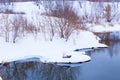 Snow-covered river bank in winter Royalty Free Stock Photo
