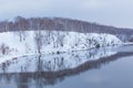 snow-covered river bank in winter Royalty Free Stock Photo