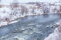snow-covered river bank in winter Royalty Free Stock Photo