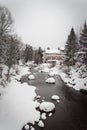 A snow covered river running in Vail, Colorado.