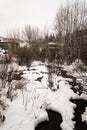 A snow covered river in Vail, Colorado during winter.