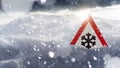 Winter driving - warning sign - risk of snow and ice Royalty Free Stock Photo