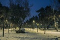 Snow covered roads in the night park with lanterns in the winter Royalty Free Stock Photo