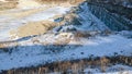 Snow covered rock quarry in winter Royalty Free Stock Photo