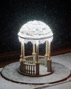 Snow-covered rotunda illuminated at night. Perm embankment. Royalty Free Stock Photo