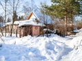 Snow-covered rural backyard in russian village Royalty Free Stock Photo