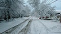 Snow-covered rural street, beautiful winter landscape, in cloudy weather Royalty Free Stock Photo