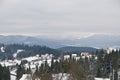 Snow covered rustic cabins in the woods in winter. Royalty Free Stock Photo