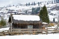 Snow covered rustic cabins in the woods in winter. Royalty Free Stock Photo