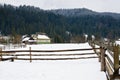 Snow covered rustic cabins in the woods in winter. Royalty Free Stock Photo