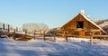 Snow covered rustic cabins in the woods in winter Royalty Free Stock Photo