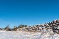 Snow covered stone wall from a low perspective Royalty Free Stock Photo