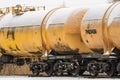 Snow covered tank-wagons of the cargo train