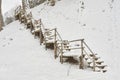 Snow-covered tourist stairs woods Royalty Free Stock Photo