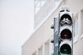 Snow-covered traffic light for bicycles against the building, Finland Royalty Free Stock Photo