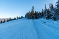 Snow covered trail with frozen trees and clear sky in winter Beskid Slaski mountains in Poland Royalty Free Stock Photo