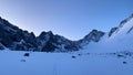 A snow-covered trail leading to the Delaunay Pass. Dawn in the Altai mountains. Climbing Mount Belukha Royalty Free Stock Photo