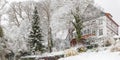 Snow covered trees and houses on the hill, beautiful winter landscape Royalty Free Stock Photo