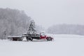 A Snow Covered Truck Waits To Deliver A Christmas Tree During A Snow Storm