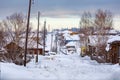 Snow-covered village street in Russian old-believer village Visim. Sverdlovsk region, Russia/ Royalty Free Stock Photo