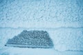 Snow-covered wall of the hut. Royalty Free Stock Photo