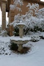 Snow Covered Water Fountain in Front Yard garden Royalty Free Stock Photo