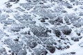 Snow Covered Rocks and Bird During Storm