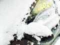 Snow-covered windshield, side window and left rear-view mirror