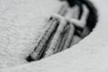 Snow covered windshield with wiper blades. Frozen snow on car in cold winter morning. Concept of driving in winter time with snow Royalty Free Stock Photo