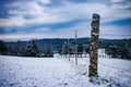 Snow covered winter field in the country with fence and trees landscape Royalty Free Stock Photo