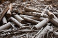 Snow covered wood log pile in the forest during winter Royalty Free Stock Photo