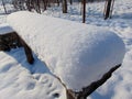 snow covered a wooden bench Royalty Free Stock Photo