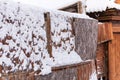 Snow-covered wooden fence of an abandoned building Royalty Free Stock Photo