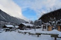 Snow covered wooden houses in Chamonix Mont Blanc Main street, France. Royalty Free Stock Photo