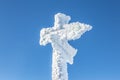 Snow covered wooden signpost in the mountains Royalty Free Stock Photo