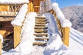 Snow covered wooden stairs in the mountains in winter Royalty Free Stock Photo