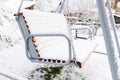 Snow covered wooden white swing after heavy snow. Winter frosty day Royalty Free Stock Photo