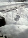 Snow Covered Yard and Driveway with Snowflake Decor