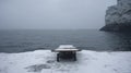 Dark Gothic Stone Bench With Avian-themed Sculptures On Snowy Ground