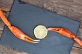 Snow crab claw with lemon on a table. Selective focus