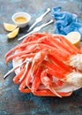 Snow crab legs plate with lemon and butter sauce