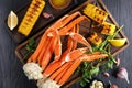 Snow Crab legs served with corn cobs