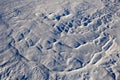Snow crust in windy Siberian location in winter in abstract shape
